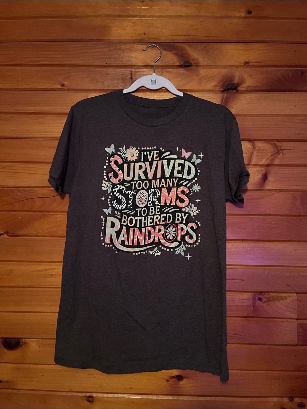 Graphic Short Sleeve Tee in Dark Gray - 'I've Survived Too Many Storms'